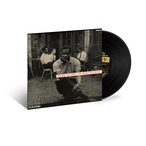 Donald Byrd album cover with a group of men and a vinyl record.
