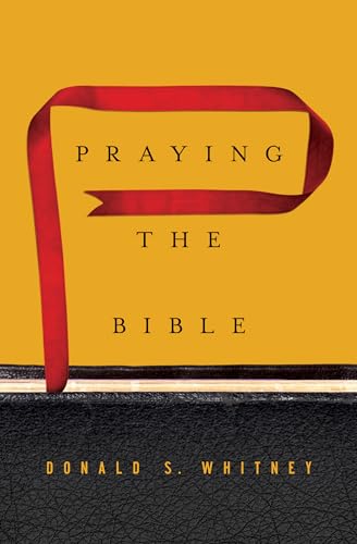 Gold book cover with red ribbon and title "Praying the Bible.