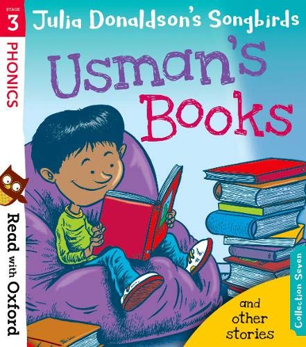 A young boy sits in a purple beanbag chair reading a red book.