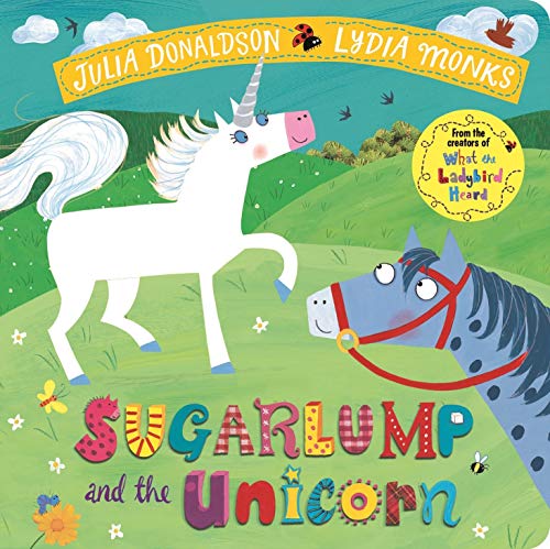 A white unicorn and blue horse on a green hill with colorful text and flowers.