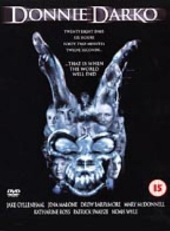 Donnie Darko" DVD cover featuring a ghostly rabbit head against a dark background.