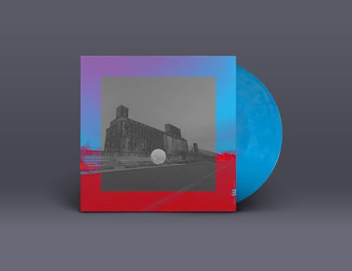 Vinyl record of Donny McCaslin’s “Lullaby For The Lost” with building artwork.