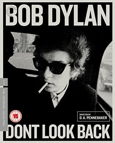 Black and white film poster of Bob Dylan with sunglasses, smoking.