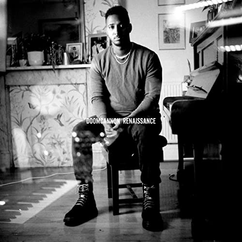 Black and white portrait of a man seated, album title overlaid.