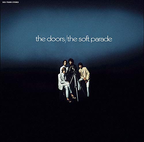 Vinyl record sleeve with "The Doors: The Soft Parade" cover art and partially visible black vinyl.