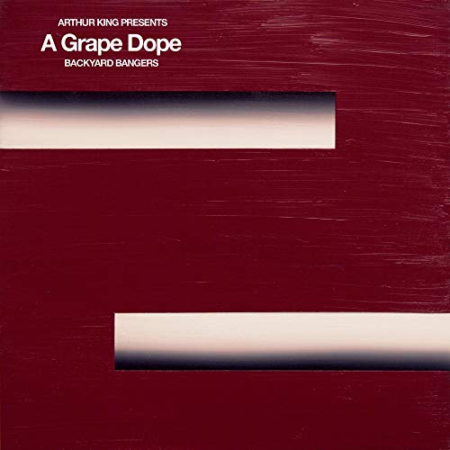 Red vinyl record cover with white text and rectangular cutouts.