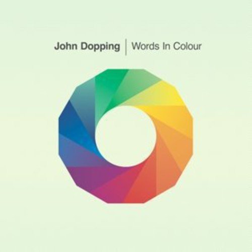 Album cover with multicolored wheel graphic on pale green background, titled "Words In Colour".