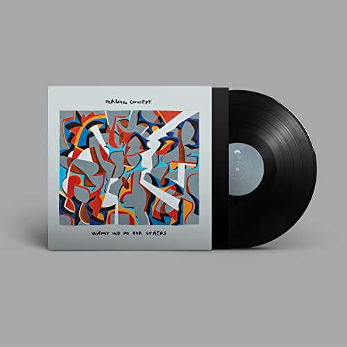 Vinyl record and cover art with abstract colorful shapes on a light background.
