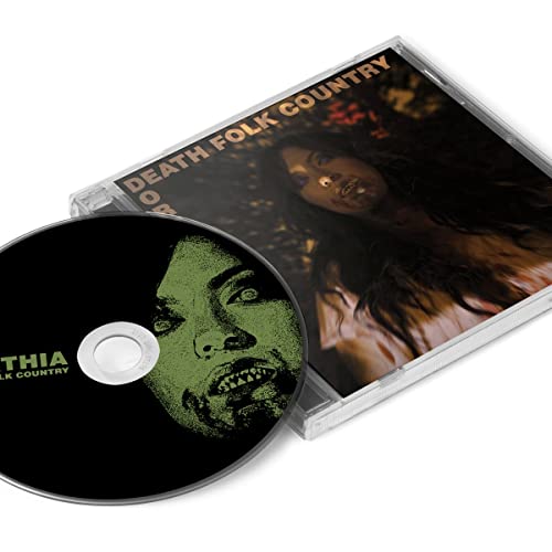 CD case open, showing a dark green portrait and silver disc.