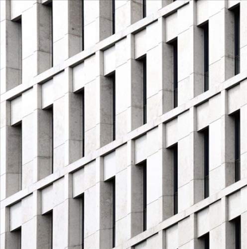 A repeating architectural pattern of light stone facade panels and vertical rectangular windows.
