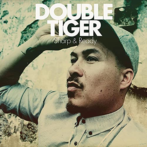 CD cover featuring a portrait of a man in a cap, looking upwards.