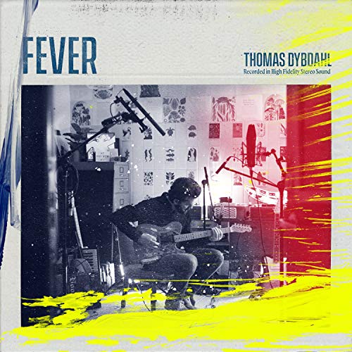 CD cover: Musician playing guitar in a cluttered recording studio.