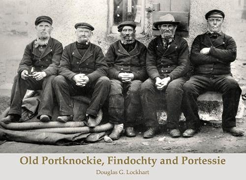 Black and white photo of five seated fishermen with pipes.