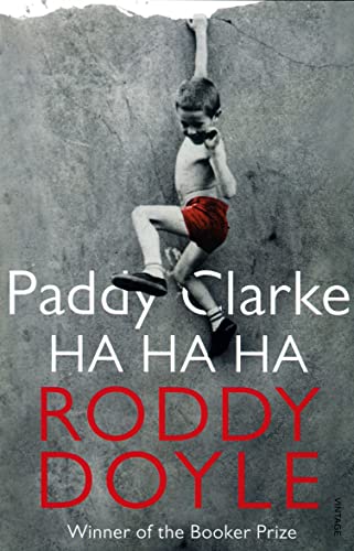 Book cover: a boy climbing a textured wall, title “Paddy Clarke Ha Ha Ha”.