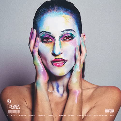 Album cover for Dragonette’s “Twennies” featuring a painted face and hands.