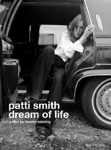 Patti Smith leaning from a car doorway, DVD cover art.
