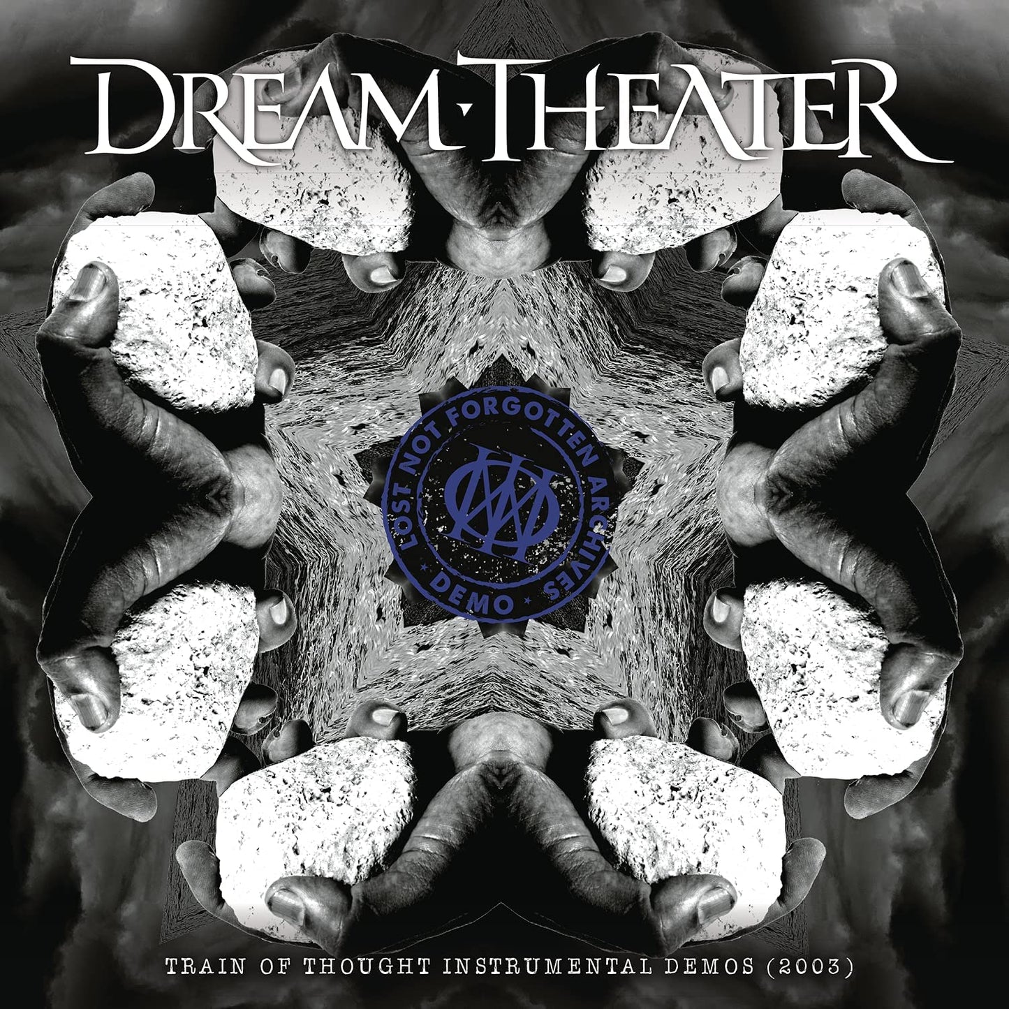 "Album cover with mirrored hands holding stones, 'Dream Theater' title and 'Lost Not Forgotten' logo."