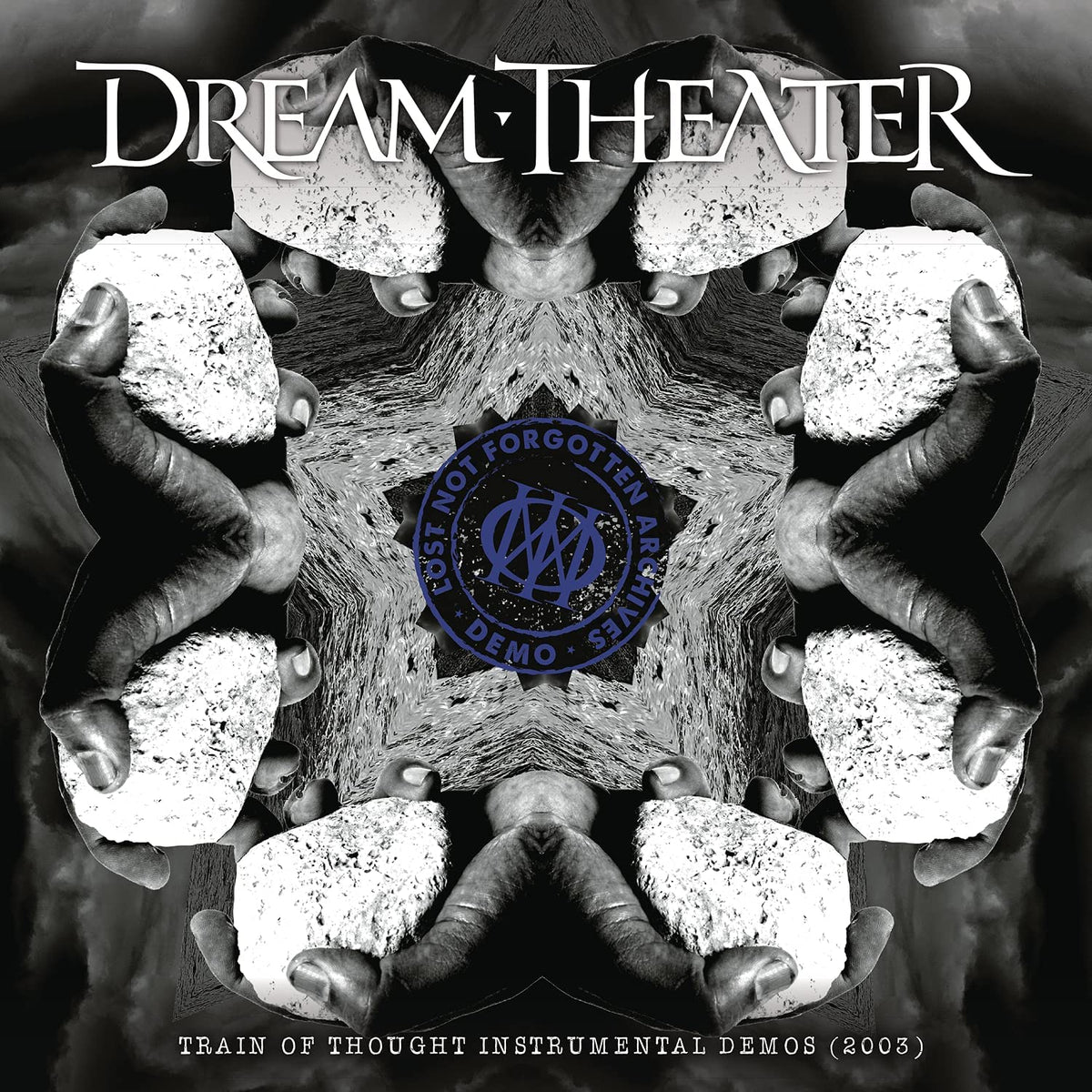 "Album cover with mirrored hands holding stones, 'Dream Theater' title and 'Lost Not Forgotten' logo."