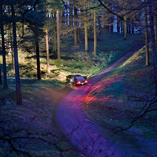 CD cover: car on a forest path with red and purple light.