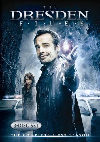 DVD cover featuring a man with glowing orb, city skyline backdrop.