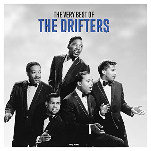 Black and white photo of The Drifters in suits against a light background.