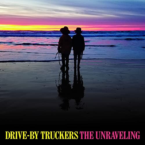 CD cover: two figures silhouetted on a beach at sunset.