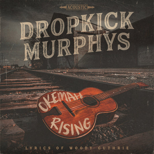 Dropkick Murphys "Okemah Rising" CD cover with guitar and railroad tracks.