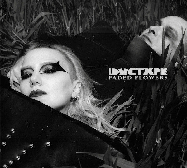 Black and white album cover featuring two people among foliage.