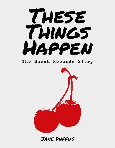 Book cover: black text, red cherries, white background, “These Things Happen.”