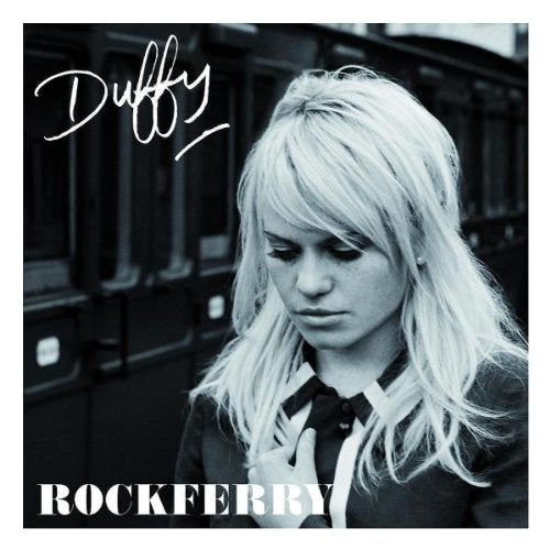 Duffy’s “Rockferry” album cover: blonde woman with train window background.
