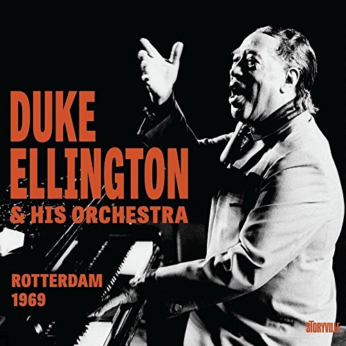 "Duke Ellington at piano, gesturing, on a black-and-white album cover with orange text."