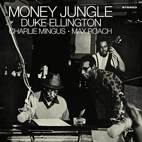 Black and white photo of Duke Ellington, Charlie Mingus, and Max Roach recording music.