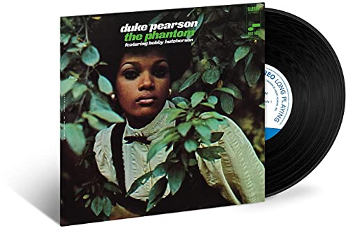 Duke Pearson’s “The Phantom” vinyl record with a portrait of a woman.