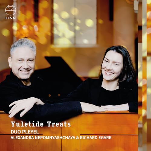 CD cover featuring a portrait of a man and woman with a piano.