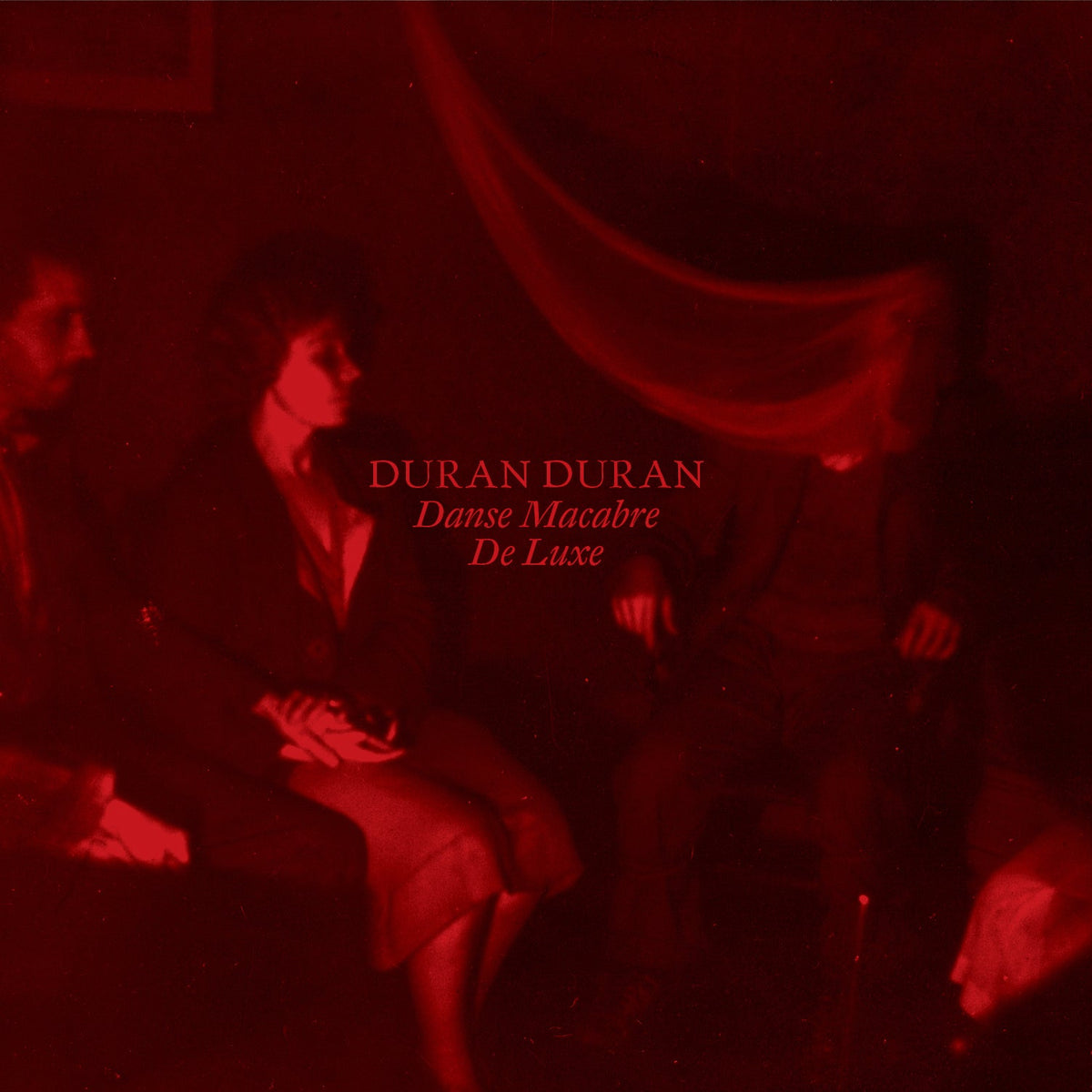 Duran Duran “Danse Macabre: De Luxe” CD cover, red-toned, blurred figures.