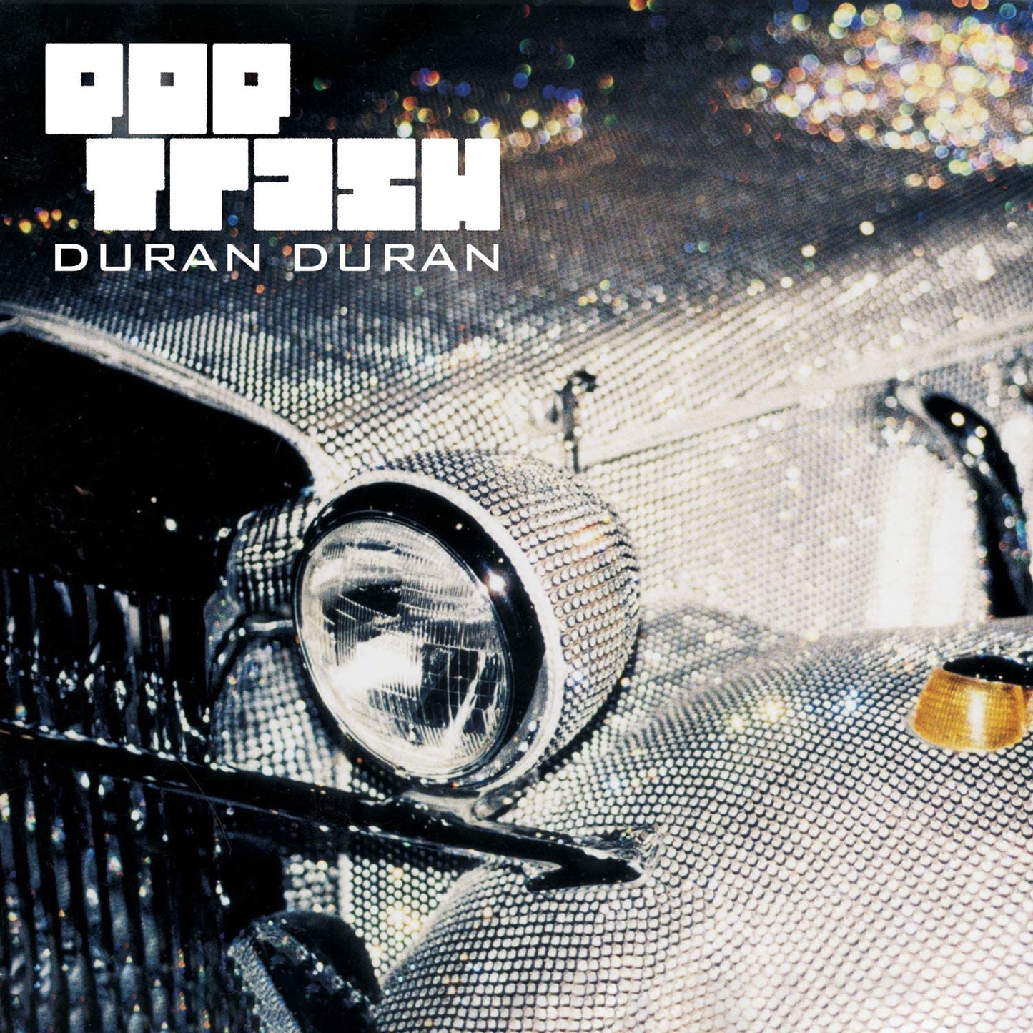 Album cover for "Pop Trash" by Duran Duran, featuring a rhinestone-covered vintage car.