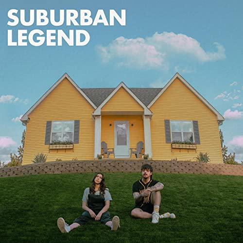Album cover: yellow house, two people on grass, blue sky.