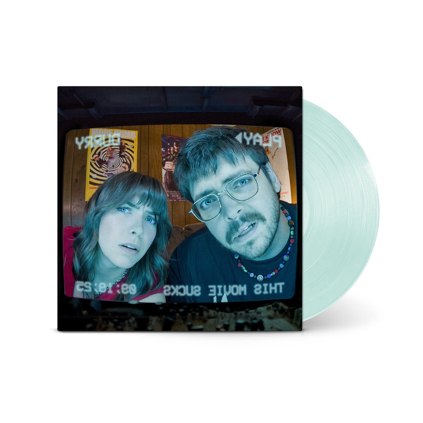Vinyl record cover showing a man and woman on a television screen next to disc.