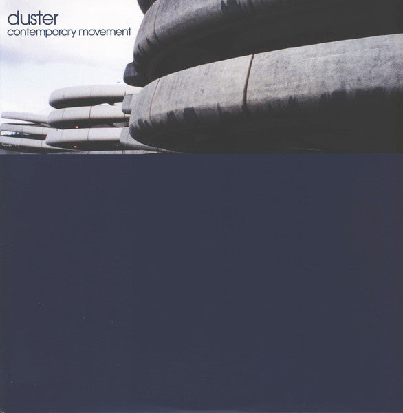 Album cover with abstract grey shapes and dark blue background, featuring "duster" and "contemporary movement" text.