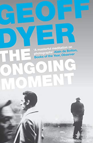 Book cover with title "The Ongoing Moment" and a black and white photograph.
