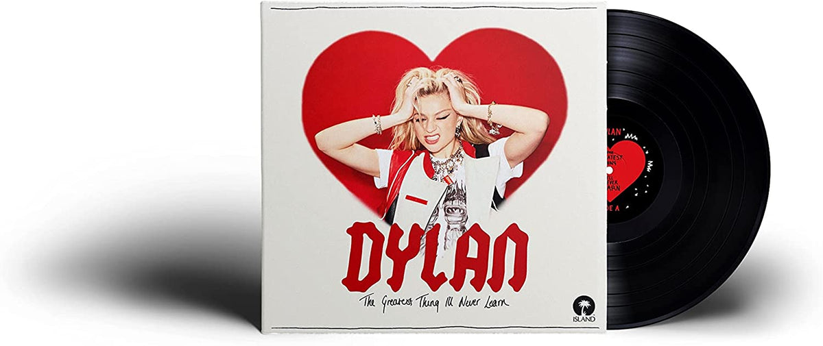 A vinyl record with a white sleeve featuring a blonde woman in a red heart.