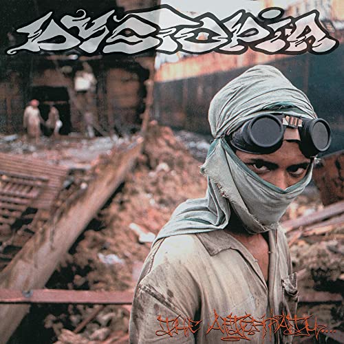 CD cover: person with goggles amid rubble, post-apocalyptic scene.
