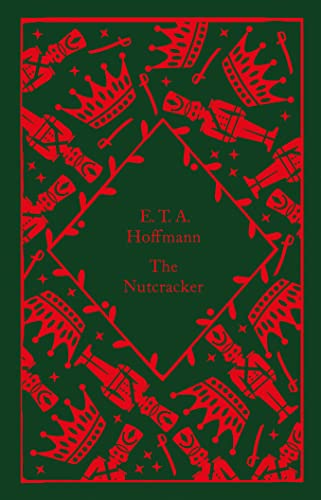 Red crowns and nutcrackers on dark green cover of "The Nutcracker.