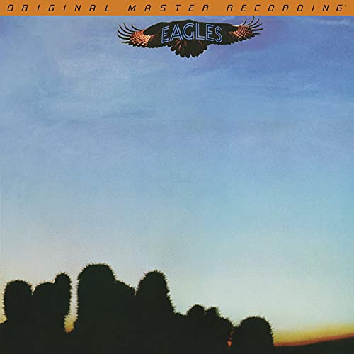 The Eagles album cover featuring an eagle in flight over silhouetted hills.