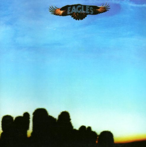 Eagles album cover with a soaring eagle above a desert landscape.