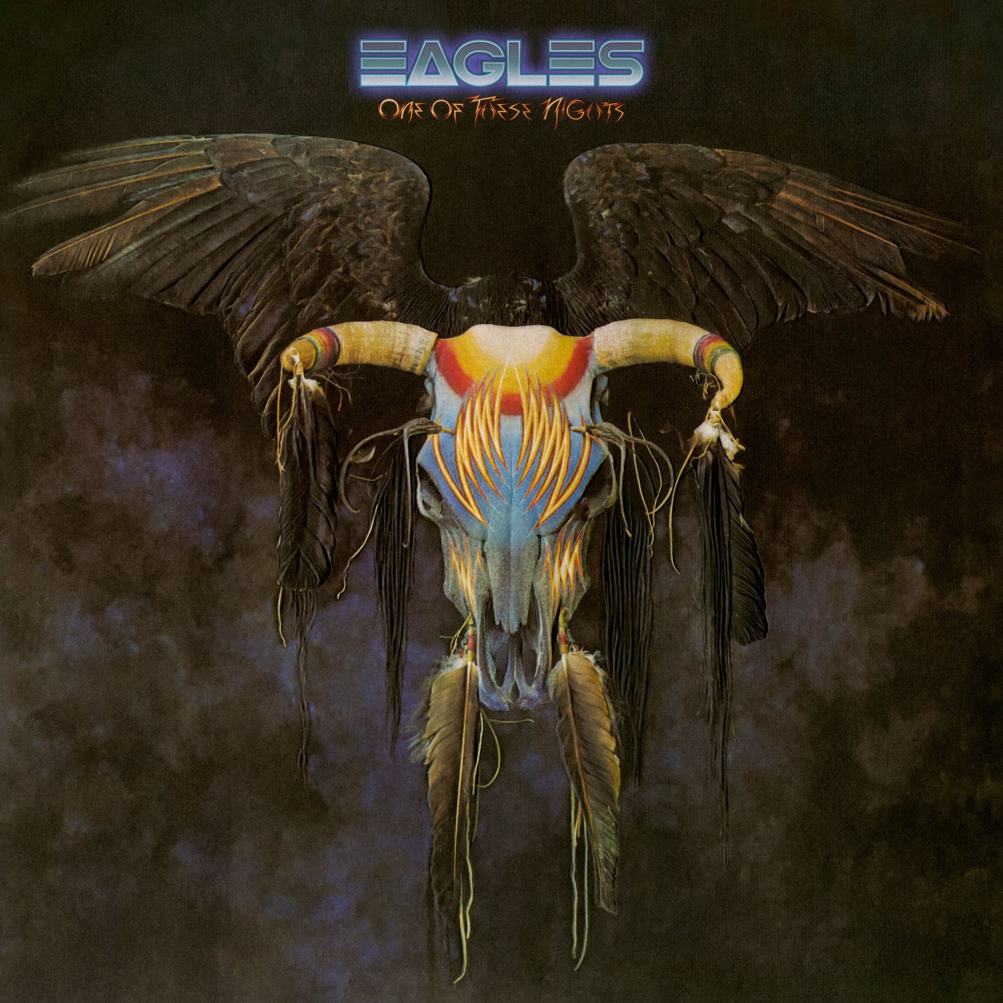 Eagles album cover: skull with wings and colorful feather details.