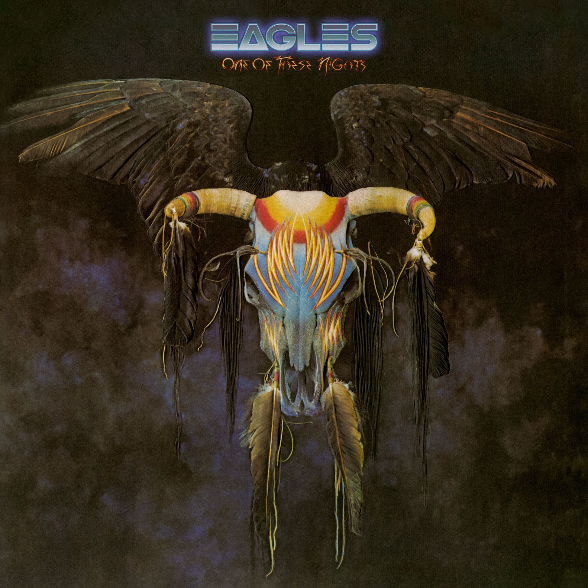 Eagles album cover: skull with wings and colorful feather details.