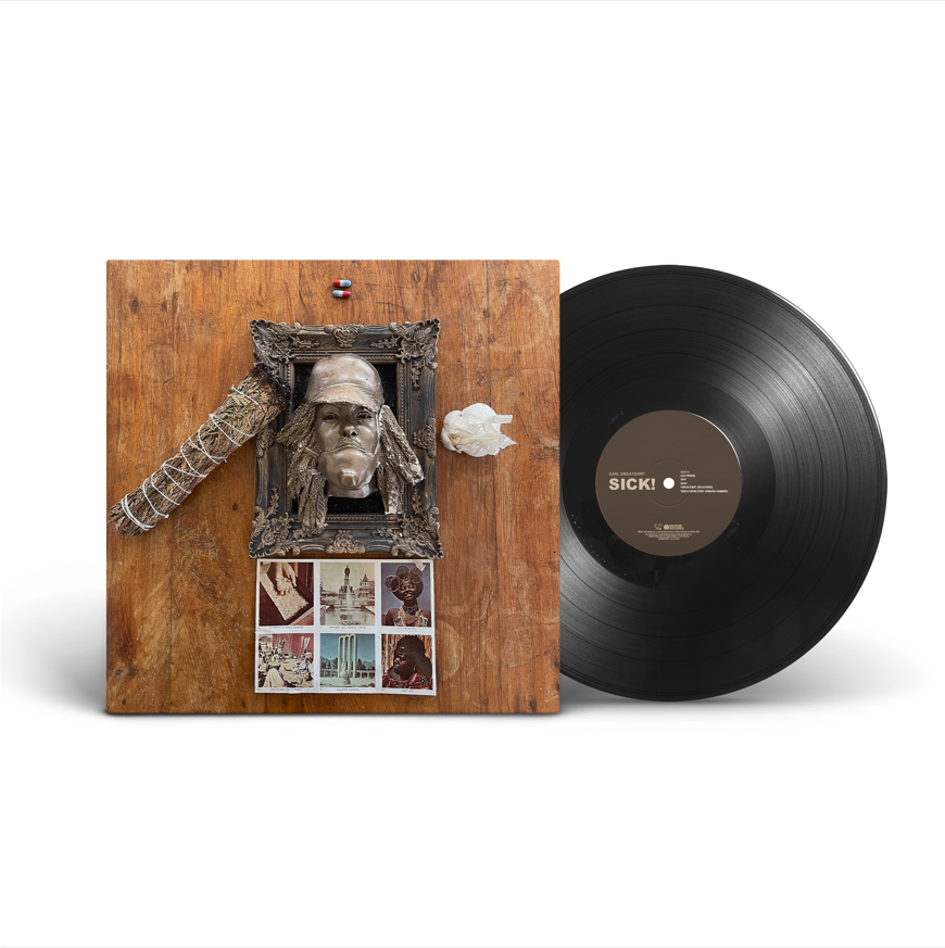 Vinyl record with a brown sleeve featuring a framed bust and collage.