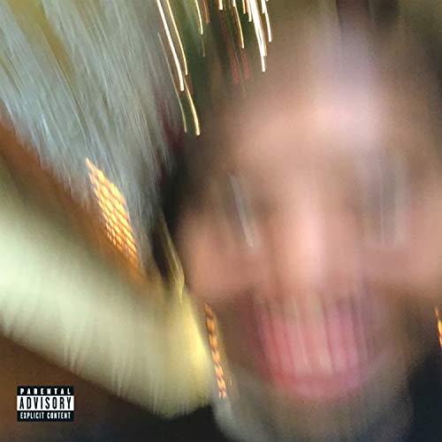 Blurred portrait with streaks of light, parental advisory label visible.