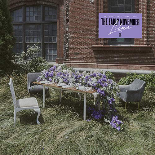 "CD cover featuring a table with lilac flowers outside a brick building."